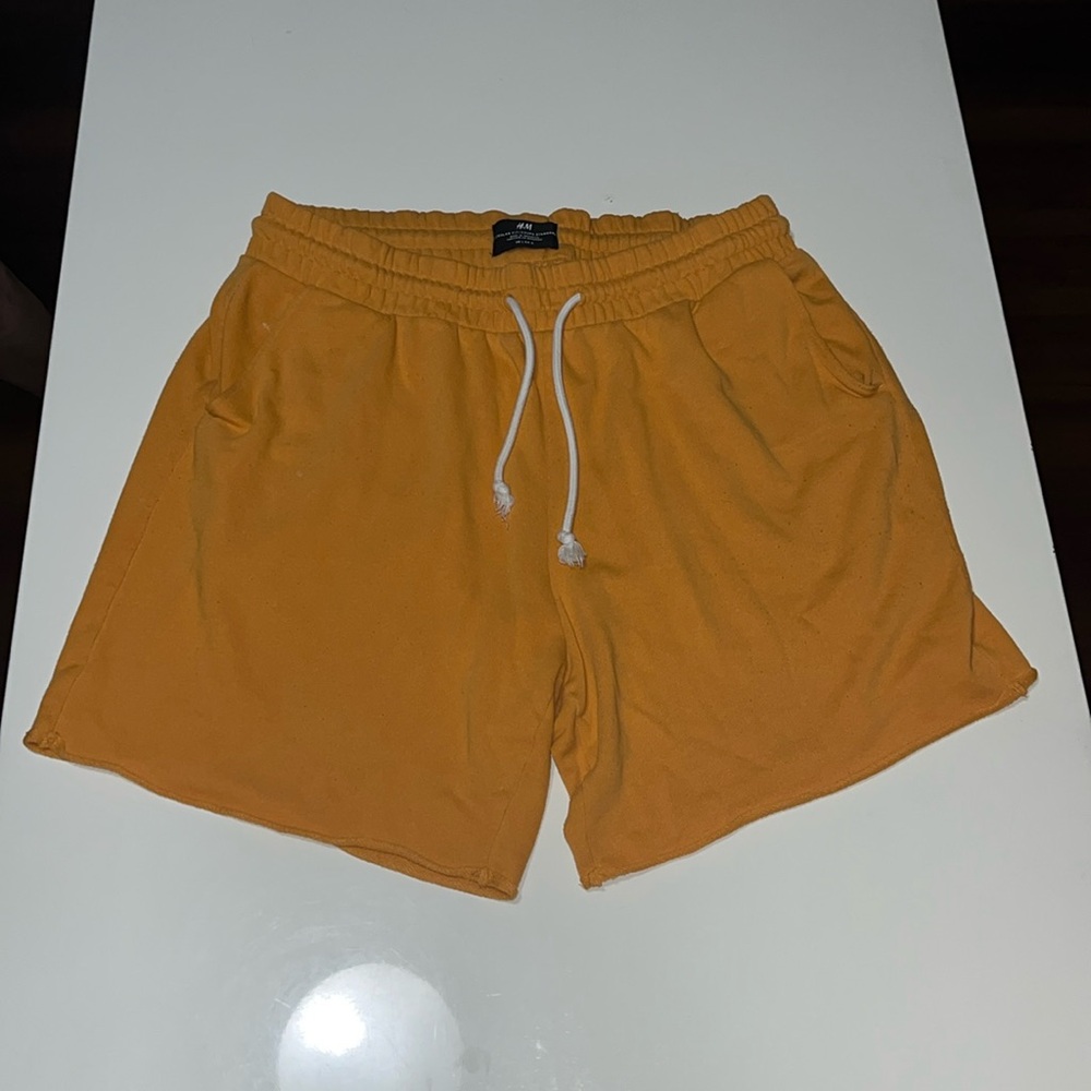H&M Light Orange Shorts, Size Large. Vibrant Color, comfortable fit.